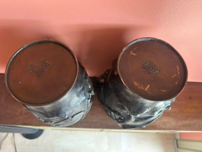 Pair of bronze vases with applied bird design
Mark...