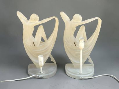 Pair of lucite lamps featuring a draped nude...
