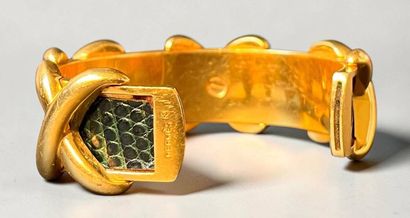 HERMÈS
Rigid bangle in gold-plated metal...