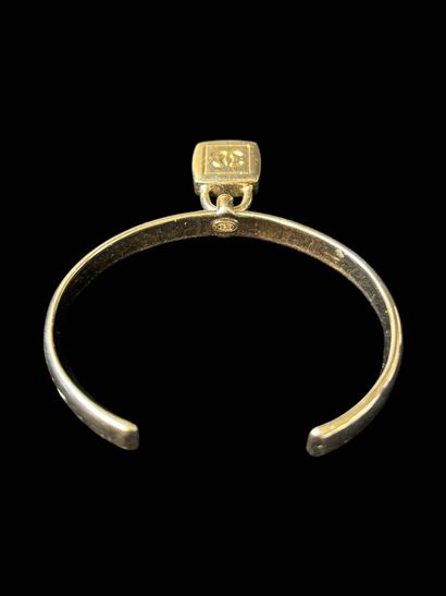 CHANEL
Rigid bangle in silver-plated metal,...
