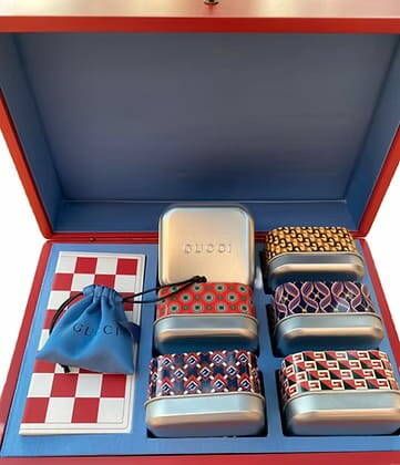 GUCCI 
Red lacquered wooden box including...