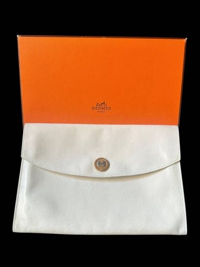 HERMÈS
RIO model
White leather clutch bag,...