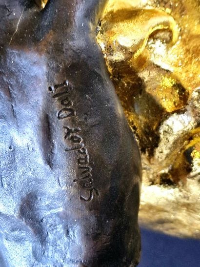 Regret
Bronze sculpture with a brown and...