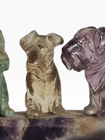 A ring holder carved from amethyst, topped...