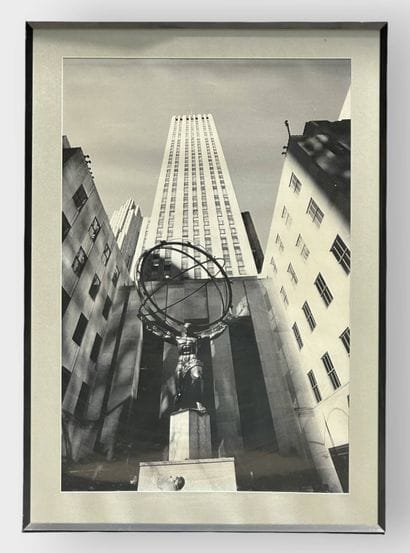 Statue of Atlas Holding Up the World in Front...