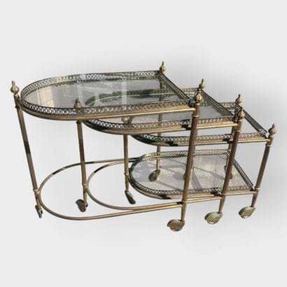 JANSEN
Three nesting side tables in brass...