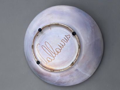 Large circular dish made of glazed red earthenware,...