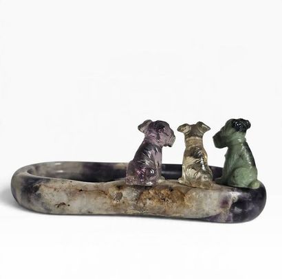 A ring holder carved from amethyst, topped...