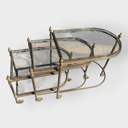 JANSEN
Three nesting side tables in brass...