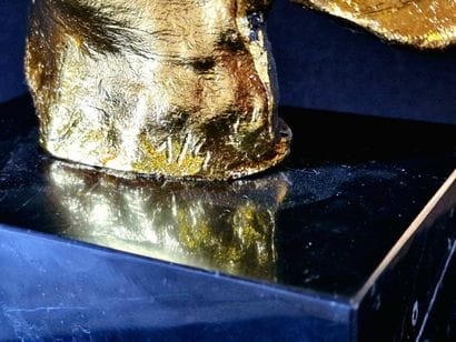 Regret
Bronze sculpture with a brown and...