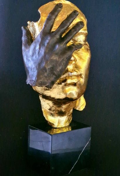 Regret
Bronze sculpture with a brown and...
