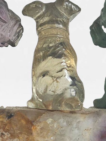 A ring holder carved from amethyst, topped...