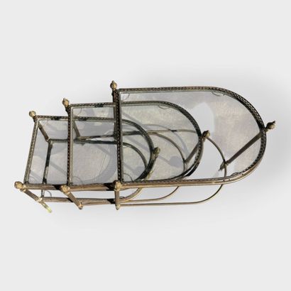 JANSEN
Three nesting side tables in brass...
