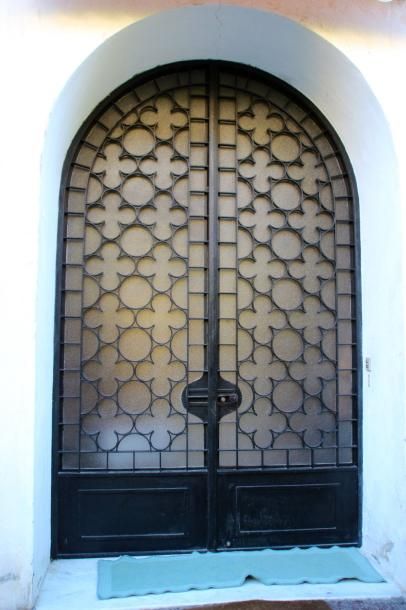 Importante porte en fer forgé et verre à...