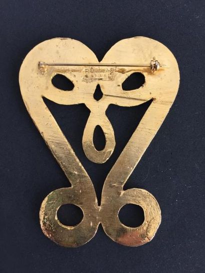ROCHAS

Broche «  volute «  en métal doré...