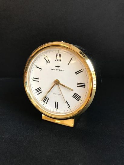 JAQUET DROZ

Petit réveil en laiton et cuir...
