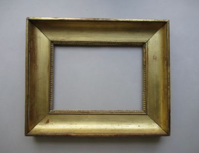 Cadre en bois et pâte doré dit 