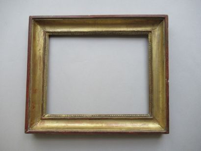 Cadre en bois et pâte doré dit 
