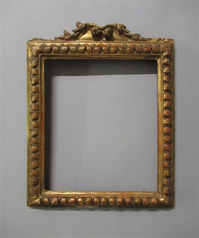 Cadre en bois sculpté, doré à profil inversé...