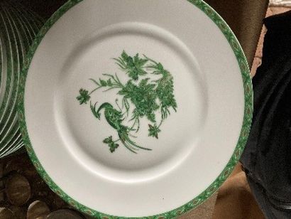 White porcelain dinner service with green...