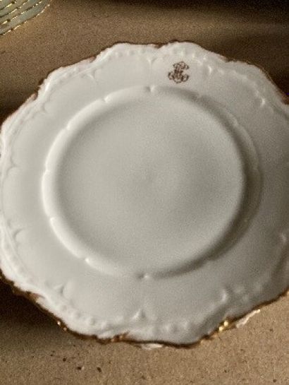 White porcelain dinner service with gilded...