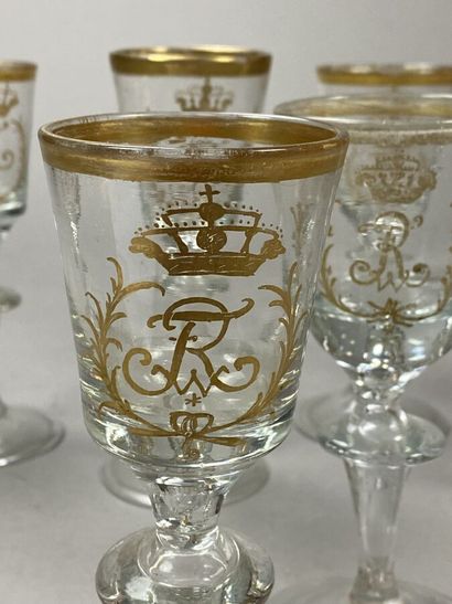 Suite of 7 crystal glasses with gold monogrammed...