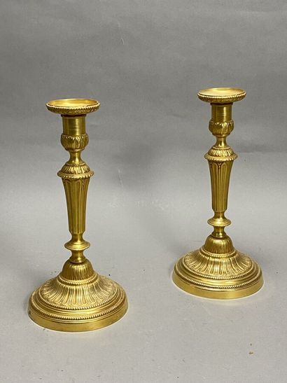 Pair of gilt brass candlesticks. 19th century
Height:...