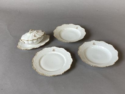 White porcelain dinner service with gilded...
