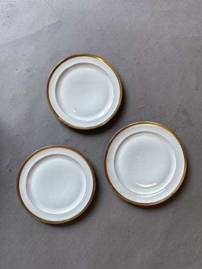 White porcelain dinner service with gilded...
