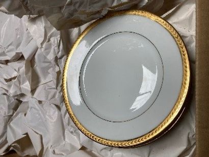 White porcelain dinner service with gilded...