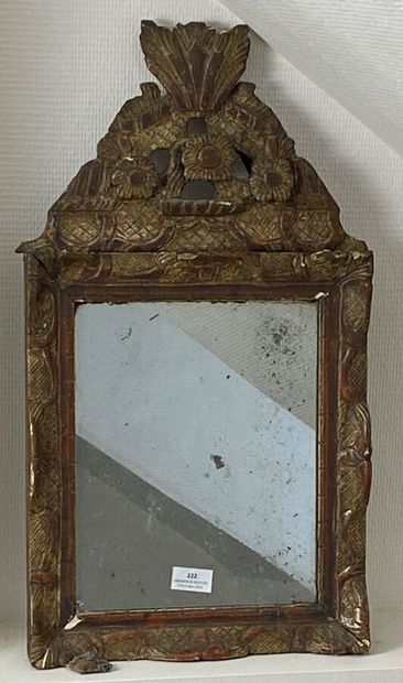 Small gilded wood mirror with flower motifs.
Provincial...