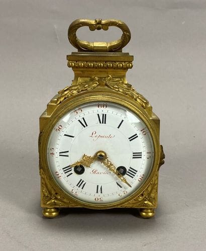 Officer's clock in gilt bronze, movement...