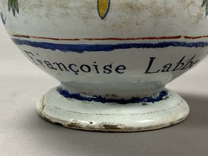 Enamelled earthenware jug with floral decoration...