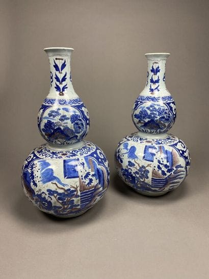 Pair of blue enameled earthenware gourd pots....