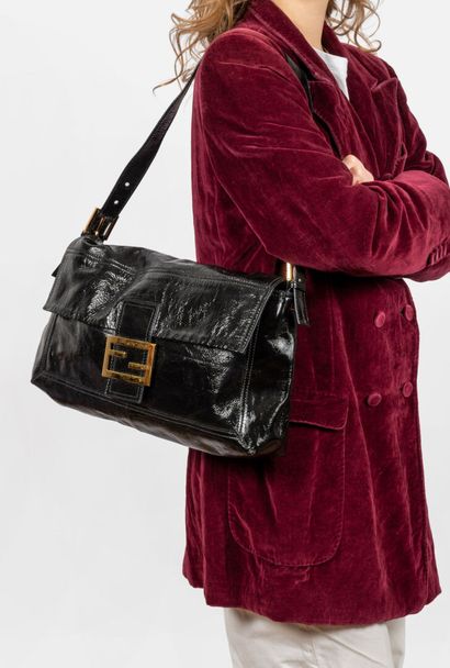 FENDI
Oversized baguette in black patent...