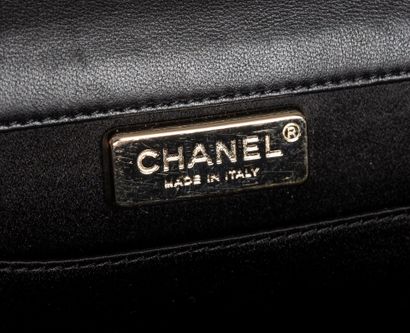 CHANEL
Clutch bag in black lambskin embellished...