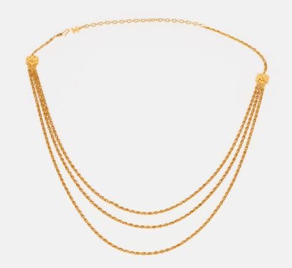 CHANEL BY KARL LAGERFELD
Three-row gold metal...