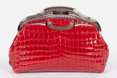 PRADA 
Bowling clutch bag in raspberry-red...