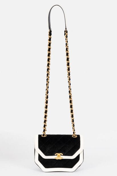 CHANEL
Black velvet flap bag trimmed with...
