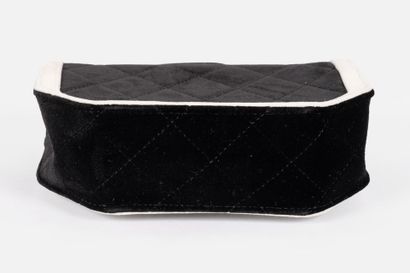 CHANEL
Black velvet flap bag trimmed with...