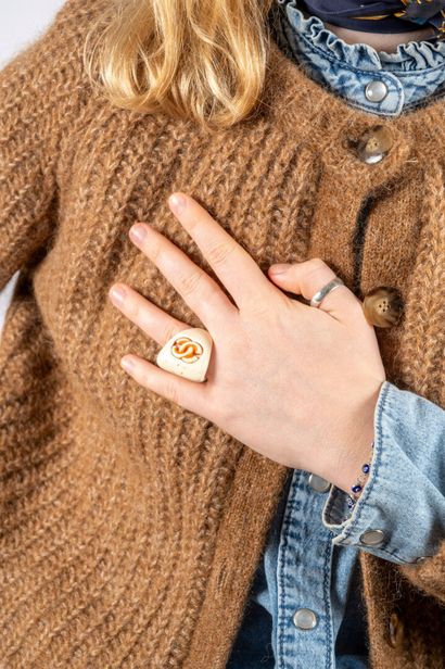 CHANEL
Varnished ivory-cream resin triangular...