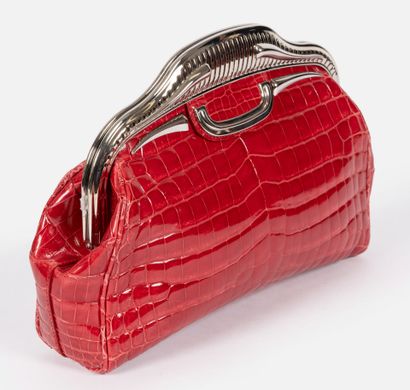 PRADA 
Bowling clutch bag in raspberry-red...