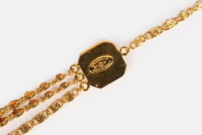 CHANEL BY KARL LAGERFELD
Three-row gold metal...