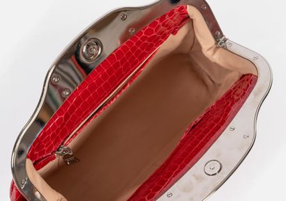 PRADA 
Bowling clutch bag in raspberry-red...