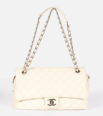 CHANEL
Flap bag in ivory quilted caviar grain...