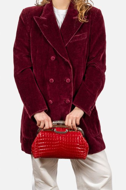 PRADA 
Bowling clutch bag in raspberry-red...