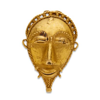 Un beau masque-pendentif en or 9K (375),...