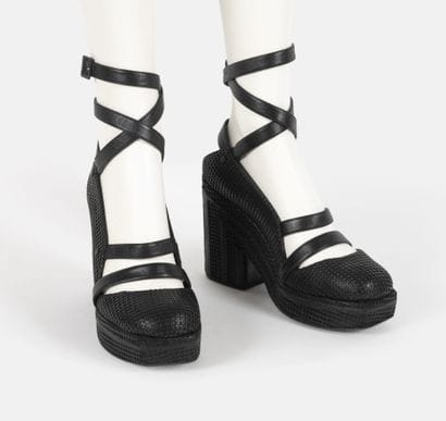 CHANEL
Pair of black leather platform sandals...