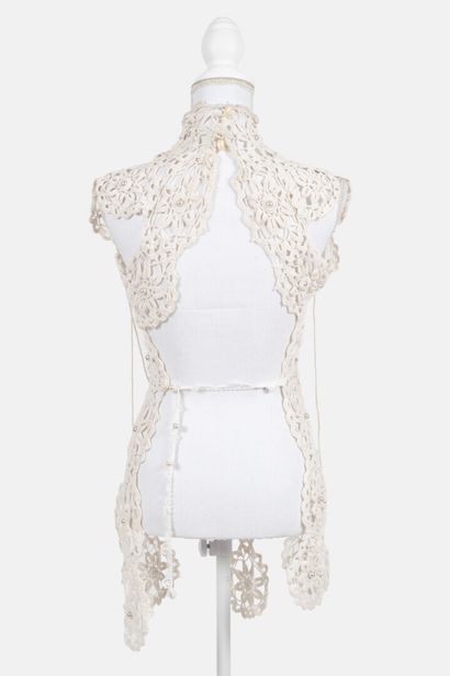 REINHARD LUTHIER
Cream-colored crocheted...