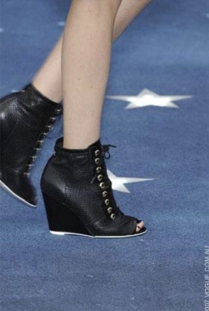 CHANEL
Pair of black braided leather high...